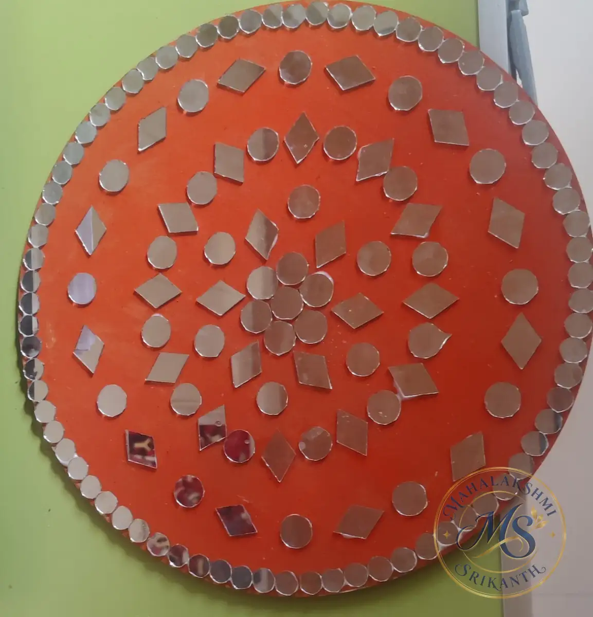Mirror Work Orange Round Plate — craft by Mahalakshmi Srikanth